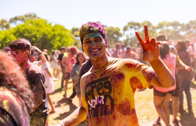 Student enjoying Holi